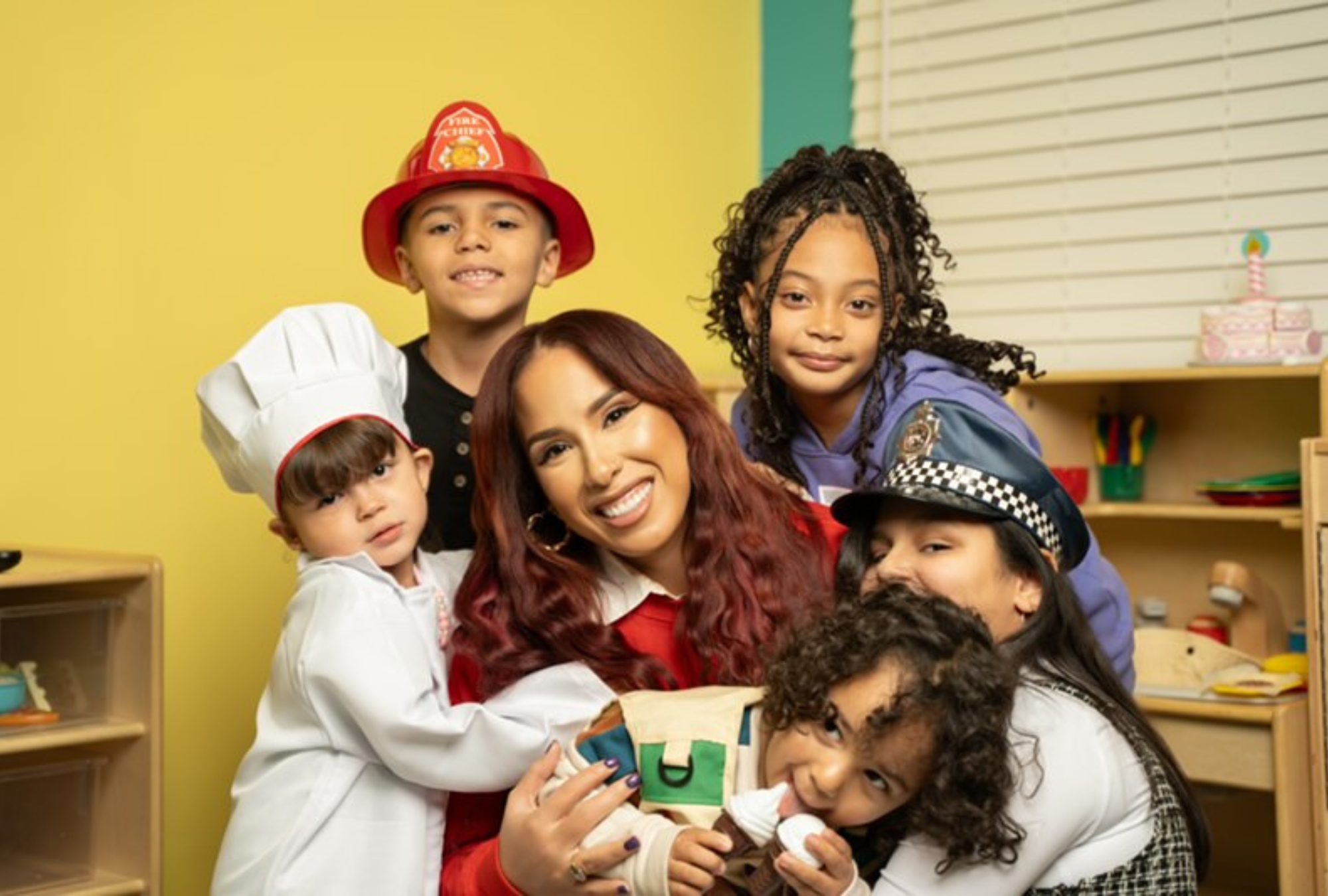 Caregiver with children in costume hats